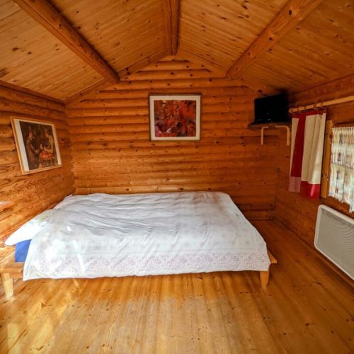 Cozy bedroom with double bed, heater, TV