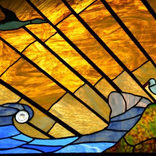 Original stain glass found at the property, depicting the marine wildlife of Point Reyes National Seashore.
