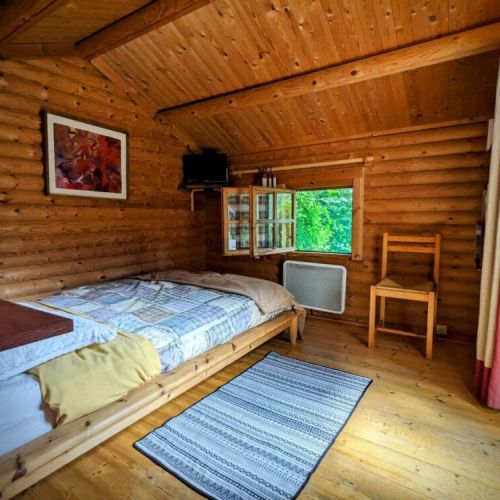 Cozy bedroom with double bed, heater, TV