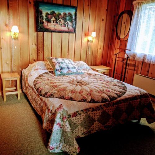 Master bedroom with one queen bed